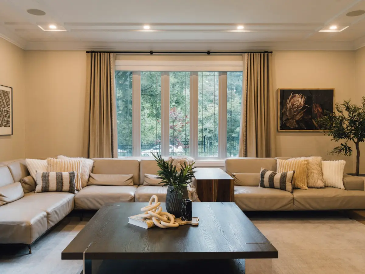Air-to-air heat pump indoor unit warming a bright living room on a winter day