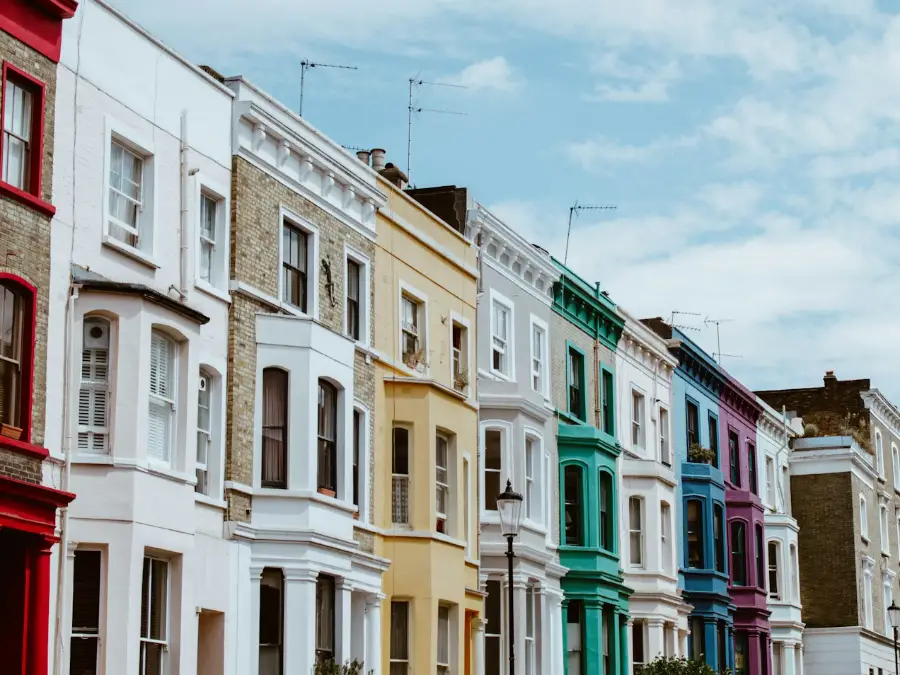 Row of colourful townhouses on a residential street