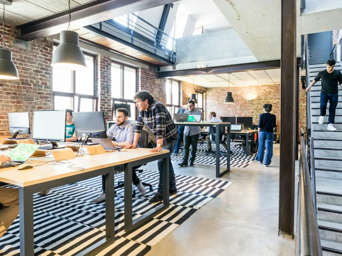 Commercial air conditioning in a bright open plan office with desks and meeting space