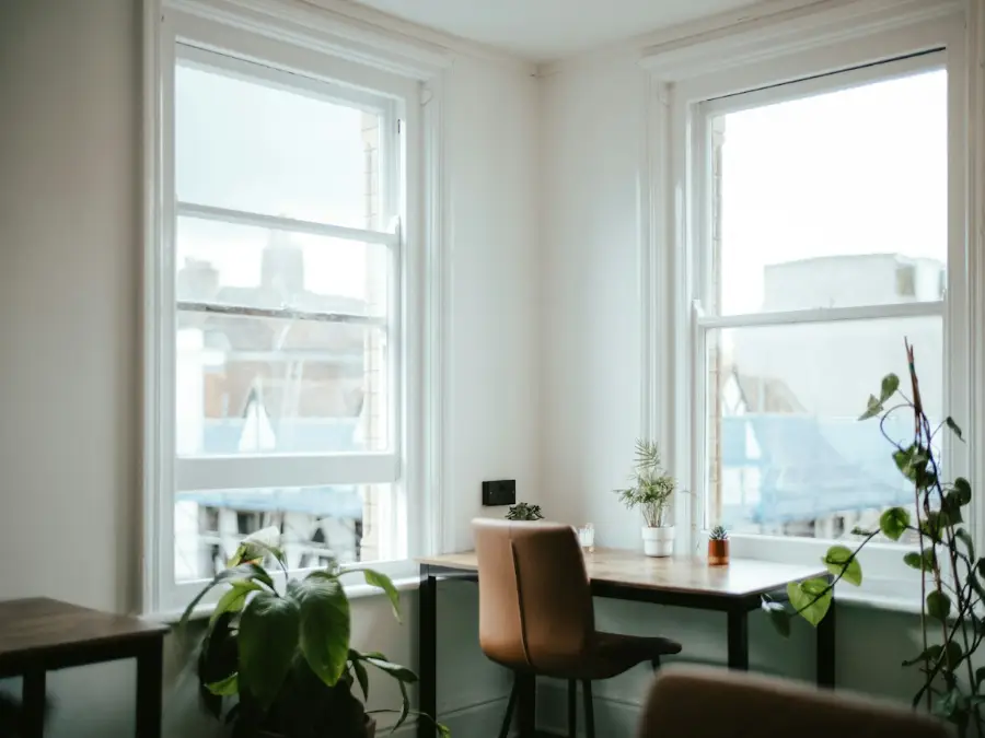 Home office kept at a steady temperature by a wall unit above the desk