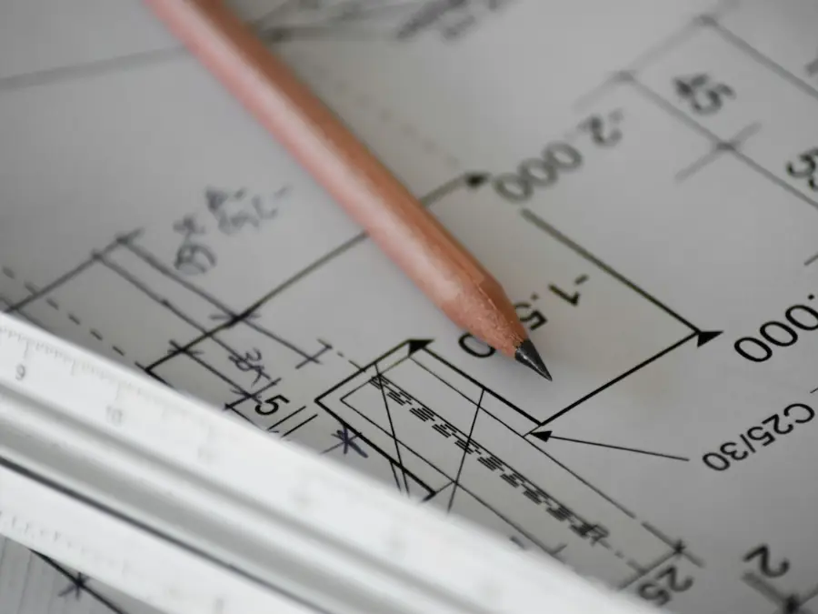 Architect plans and a pencil on a desk