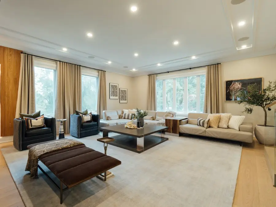 Living room with a wall-mounted indoor unit that is one of several rooms on the same system
