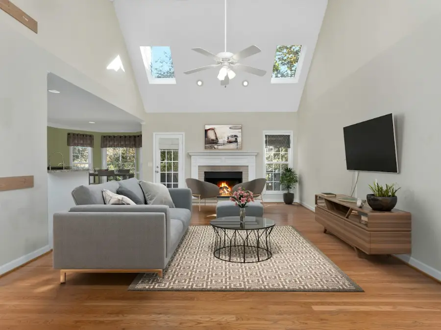 Living room with concealed air conditioning grilles and no units on the walls