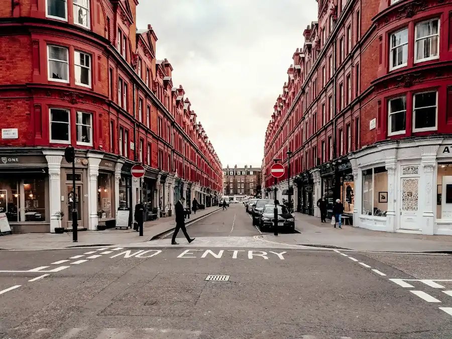 Street of red brick Victorian terraced houses in London