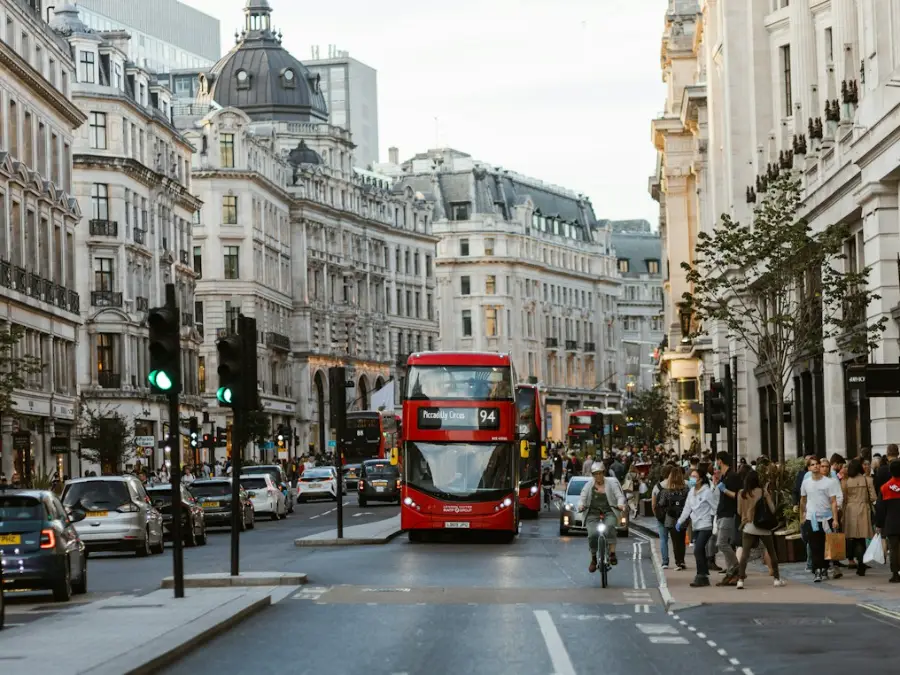 Red double decker bus on a busy London street