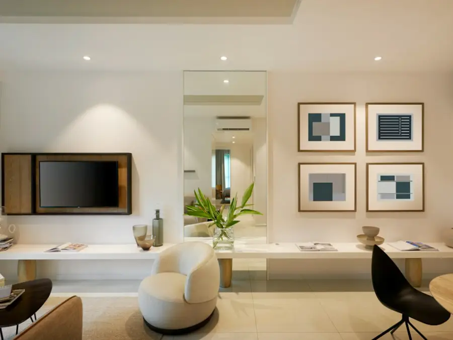 Calm neutral living room with artwork, kept warm in winter by a wall unit