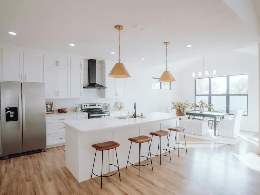 Open plan kitchen and dining room with a larger indoor unit on the far wall