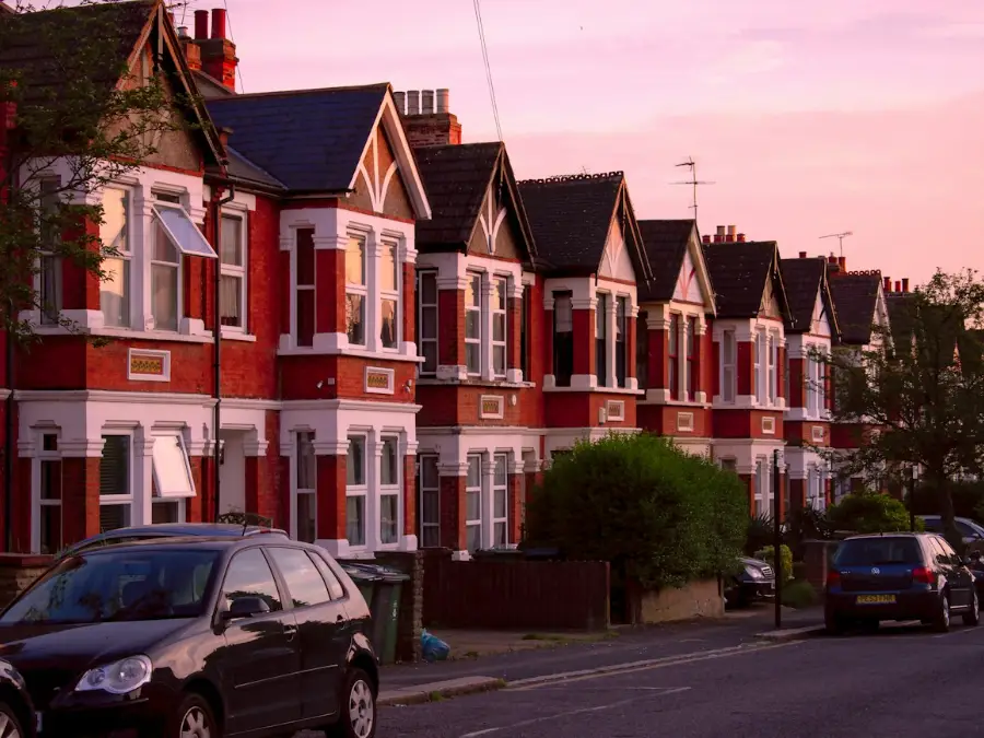 Red brick terraced houses on a sunny street