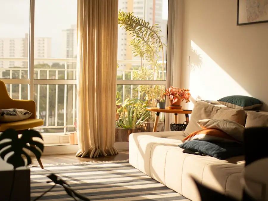 Sunny lounge with tall windows where a wall-mounted heat pump would keep the room cool