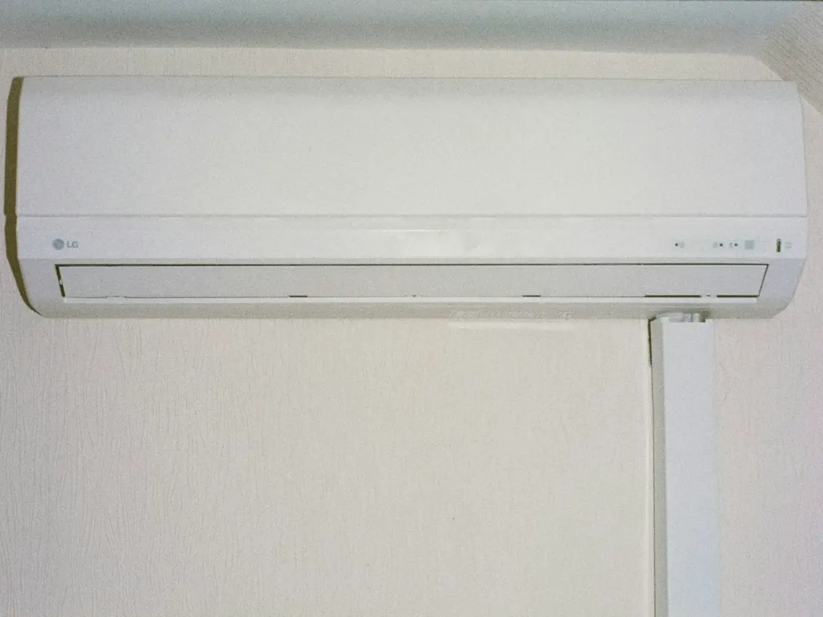 New wall-mounted indoor unit fitted high on a living room wall