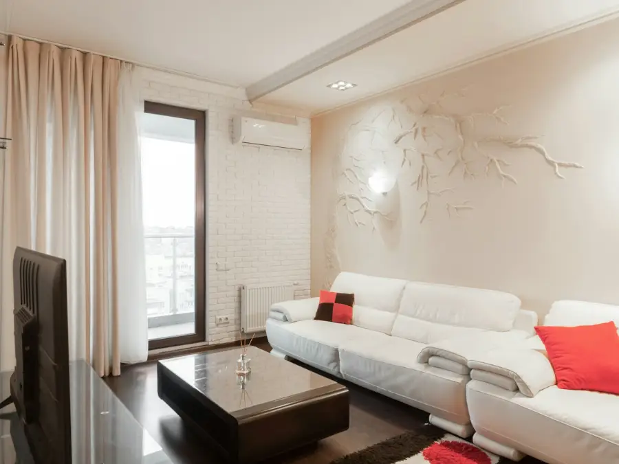 White sofa in a calm lounge with a pale wall